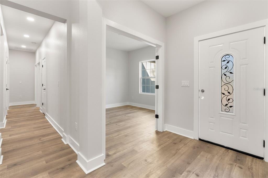 8264 Southwest 128th Terrace Dunnellon, FL 34432 - Photo 2 of 27 a view of a hallway with wooden floor and closet
