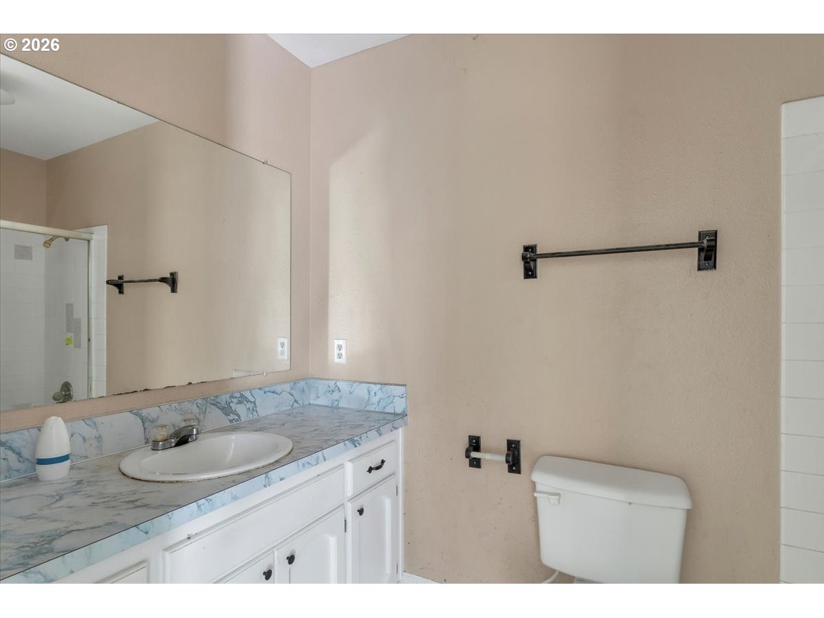 1645 Southwest 27th Street Gresham, OR 97080 - Photo 16 of 48 a bathroom with a granite countertop sink and a mirror