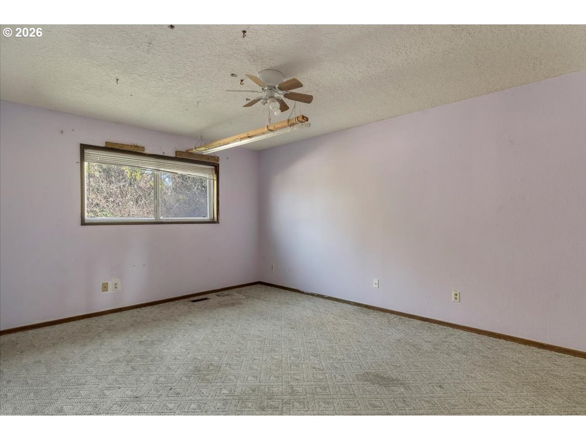 1645 Southwest 27th Street Gresham, OR 97080 - Photo 17 of 48 a view of an empty room with a window
