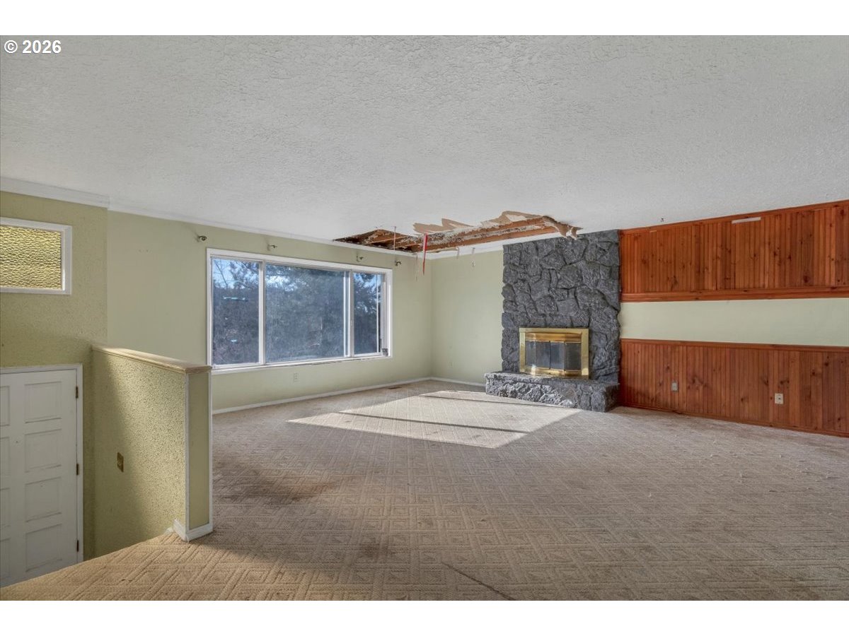 1645 Southwest 27th Street Gresham, OR 97080 - Photo 2 of 48 a view of an empty room with a fireplace