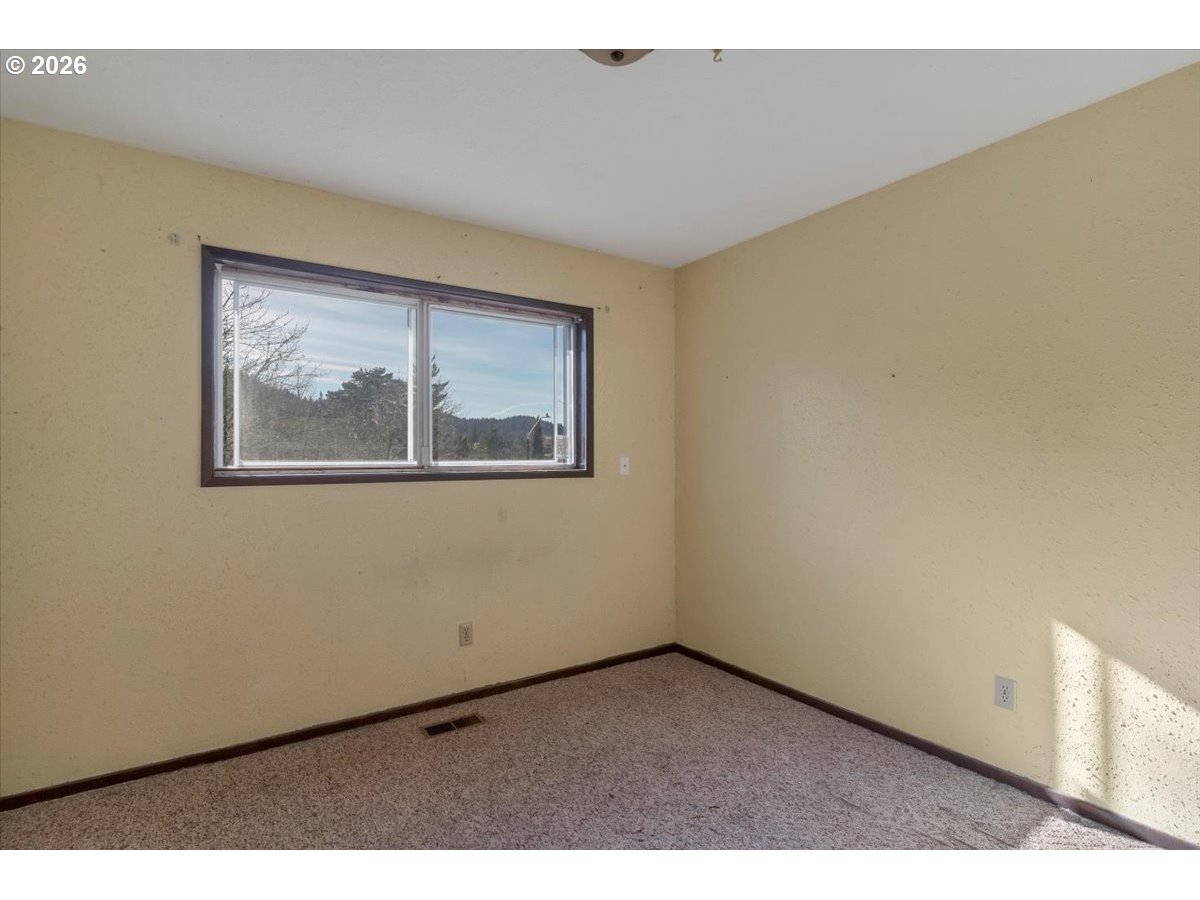 1645 Southwest 27th Street Gresham, OR 97080 - Photo 23 of 48 a view of an empty room with a window
