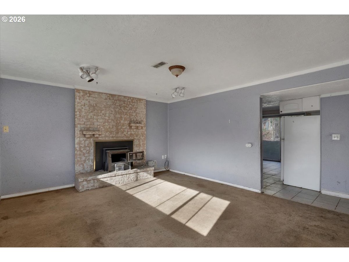 1645 Southwest 27th Street Gresham, OR 97080 - Photo 27 of 48 a living room with furniture and a fireplace