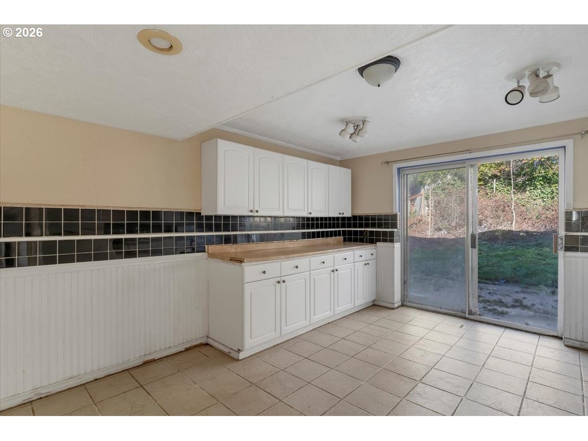 1645 Southwest 27th Street Gresham, OR 97080 - Photo 29 of 48 a kitchen with a sink and cabinets