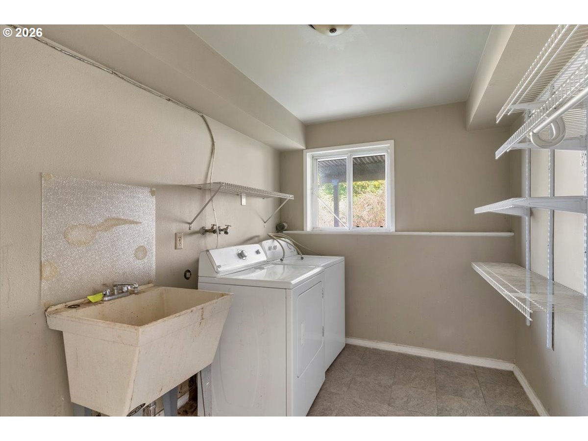 1645 Southwest 27th Street Gresham, OR 97080 - Photo 33 of 48 a kitchen with sink cabinets and window