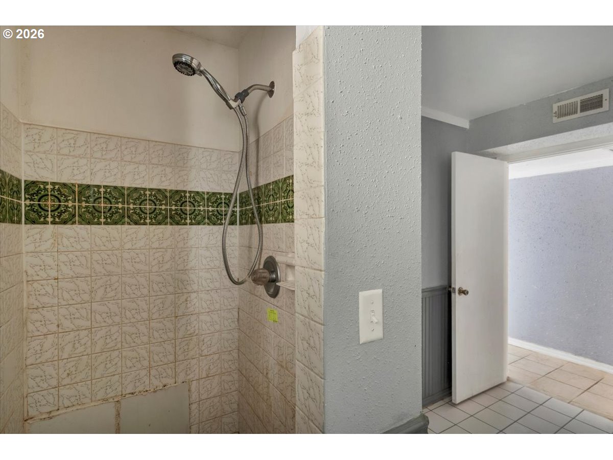1645 Southwest 27th Street Gresham, OR 97080 - Photo 35 of 48 a bathroom with a shower