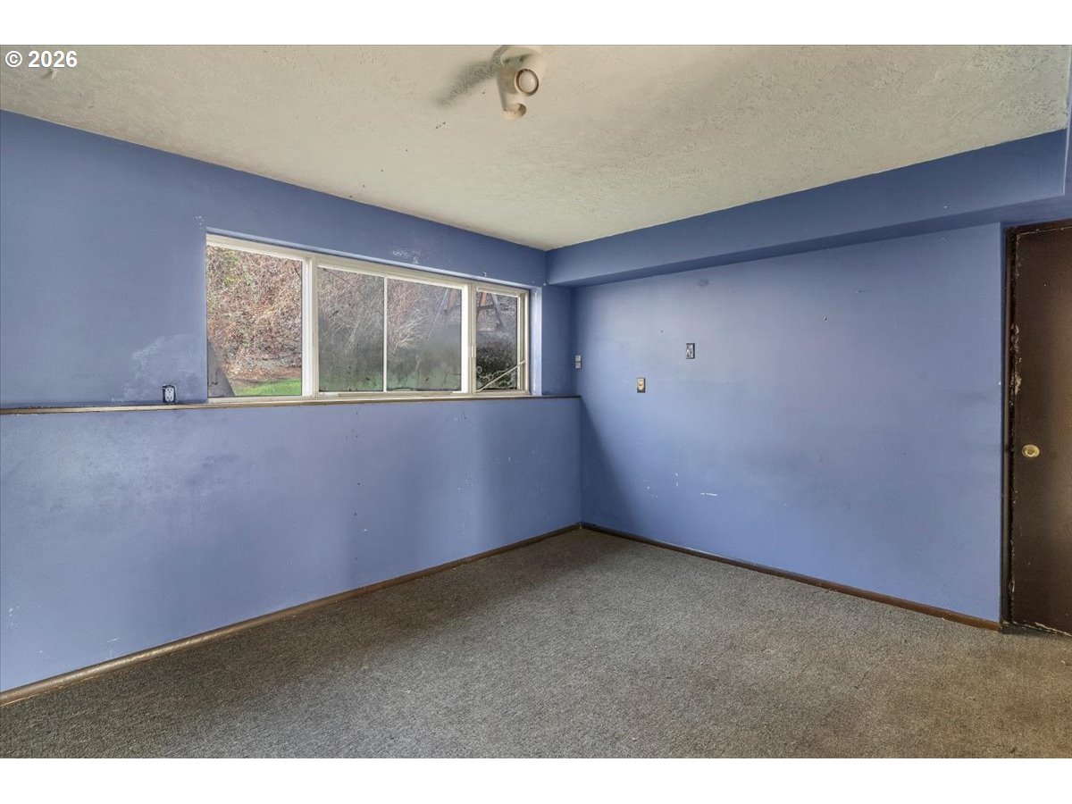 1645 Southwest 27th Street Gresham, OR 97080 - Photo 36 of 48 a view of an empty room with a window