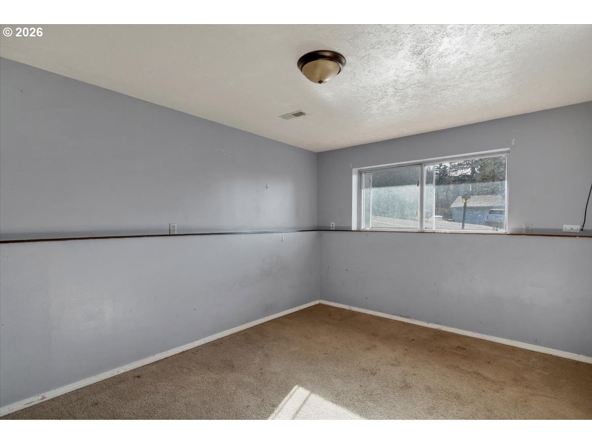 1645 Southwest 27th Street Gresham, OR 97080 - Photo 37 of 48 a view of an empty room with a window