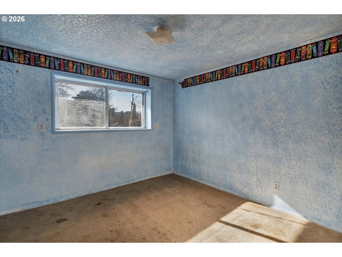 1645 Southwest 27th Street Gresham, OR 97080 - Photo 39 of 48 a view of an empty room with a window