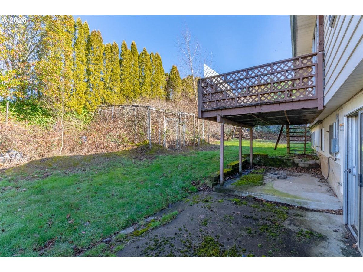 1645 Southwest 27th Street Gresham, OR 97080 - Photo 46 of 48 a view of a backyard with plants and outdoor seating
