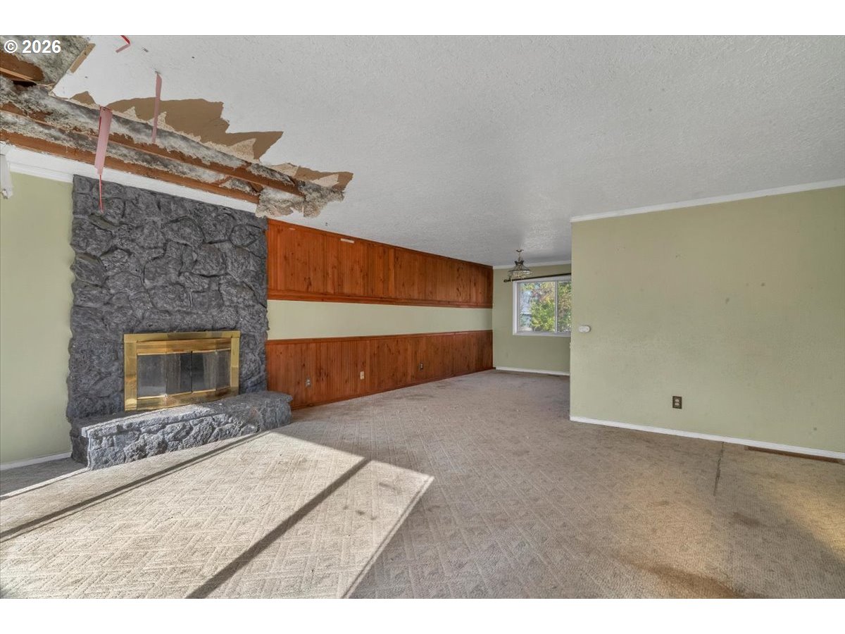 1645 Southwest 27th Street Gresham, OR 97080 - Photo 5 of 48 a view of an empty room with a fireplace