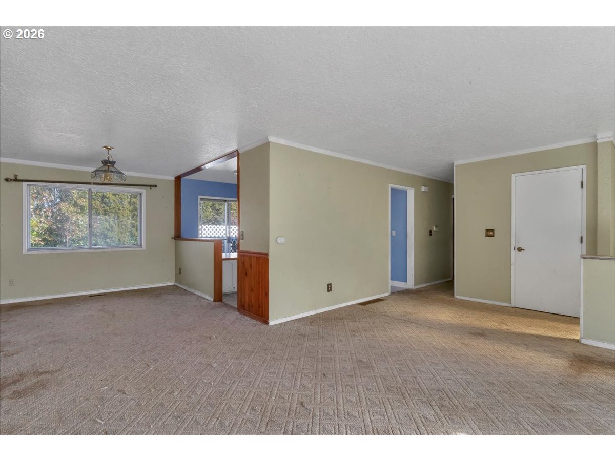 1645 Southwest 27th Street Gresham, OR 97080 - Photo 6 of 48 a view of an empty room with a window