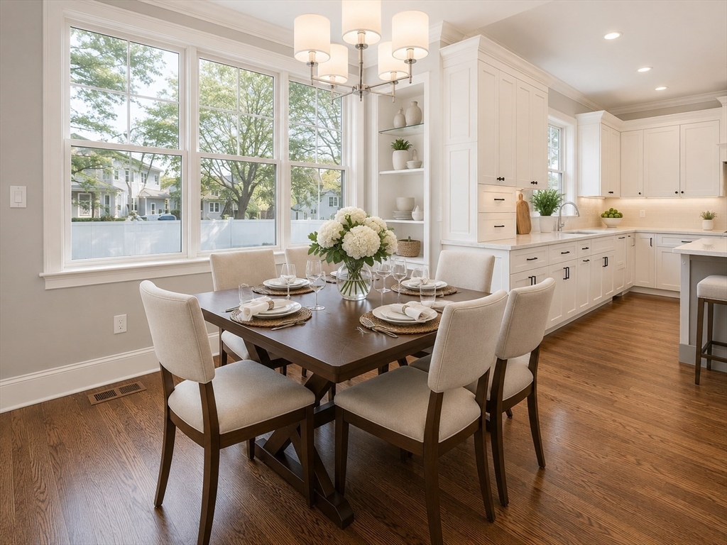 35 Hanson Road, Unit 35 Newton, MA 02459 - Photo 3 of 13 a view of a dining room with furniture window and wooden floor