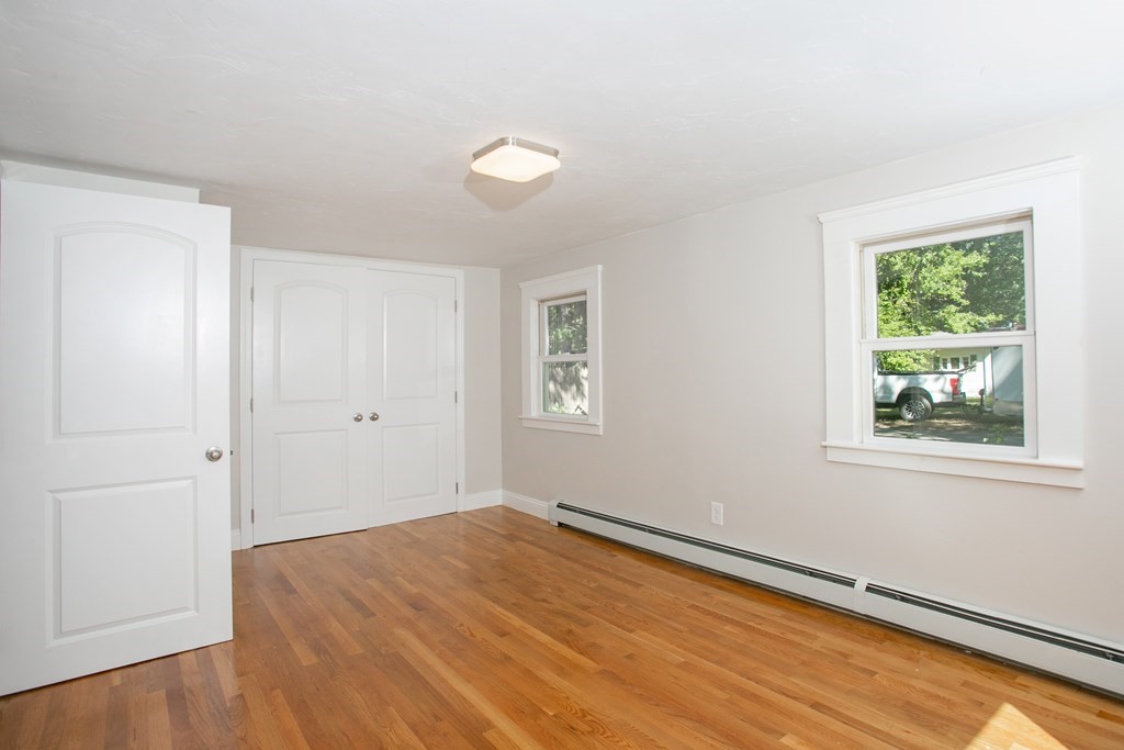 48 Madison Road Halifax, MA 02338 - Photo 11 of 12 a big room with wooden floor and windows