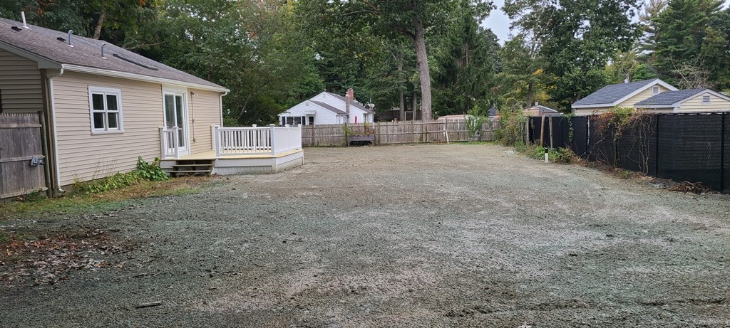 48 Madison Road Halifax, MA 02338 - Photo 12 of 12 a view of backyard of house with wooden fence