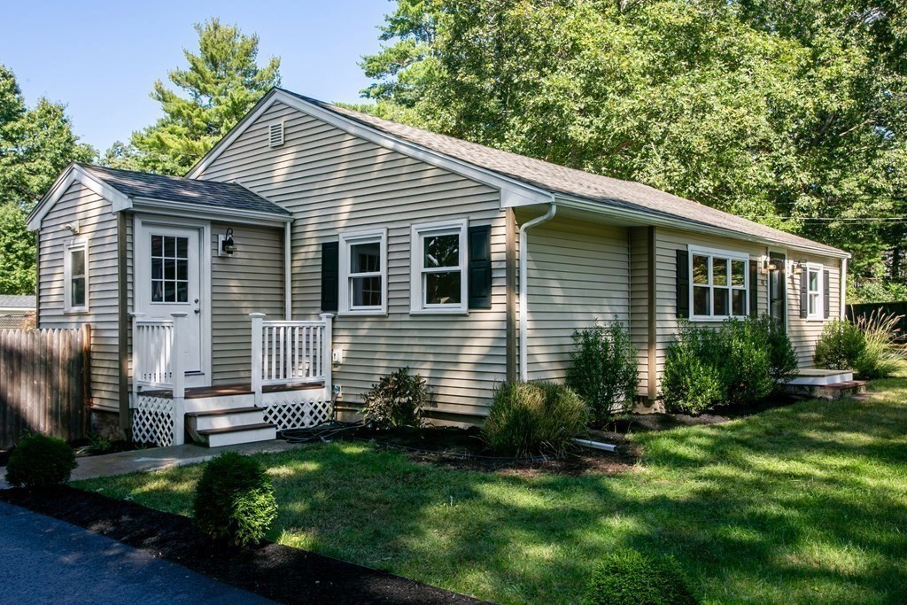48 Madison Road Halifax, MA 02338 - Photo 2 of 12 a front view of a house with a yard