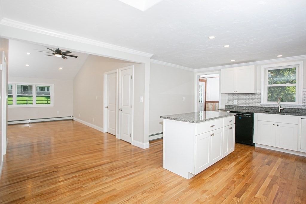 48 Madison Road Halifax, MA 02338 - Photo 3 of 12 a large kitchen with a wooden floor and a large window