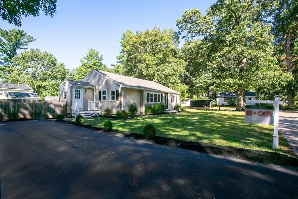 48 Madison Road Halifax, MA 02338 - Photo 4 of 12 a front view of a house with a garden