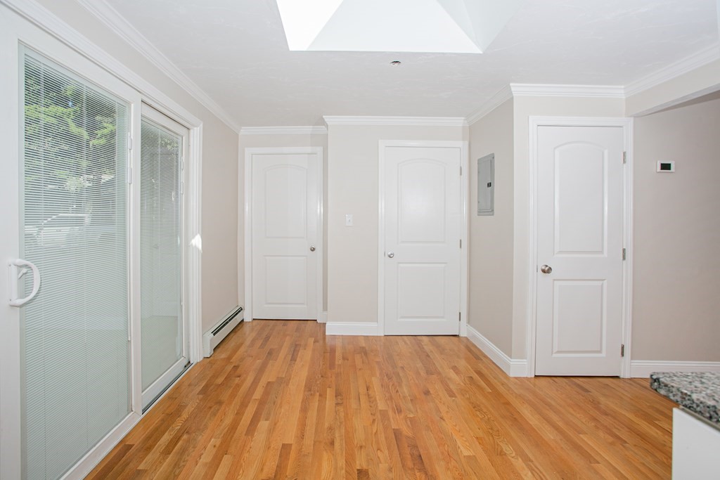 48 Madison Road Halifax, MA 02338 - Photo 5 of 12 a view of a room with wooden floor and a bathroom