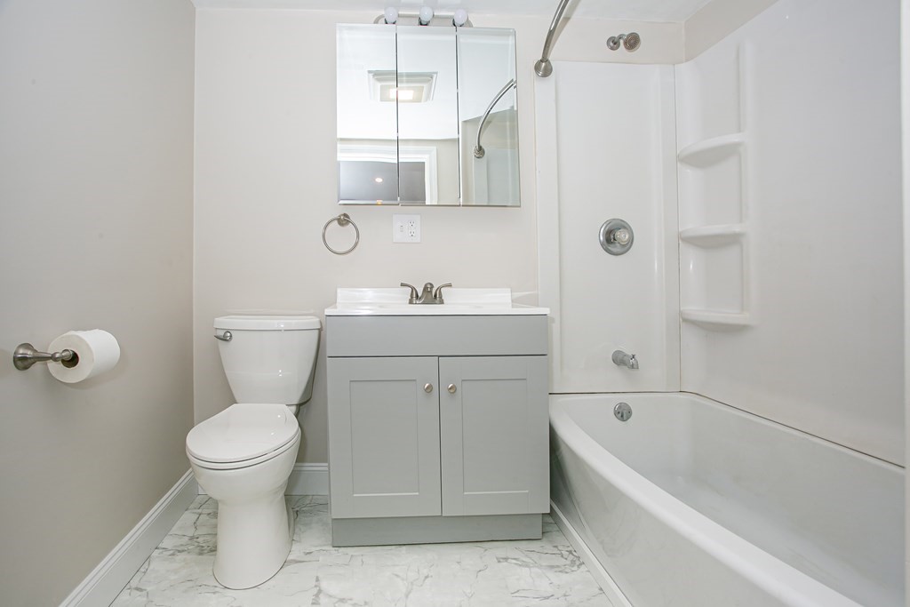 48 Madison Road Halifax, MA 02338 - Photo 7 of 12 a bathroom with a sink a toilet and shower