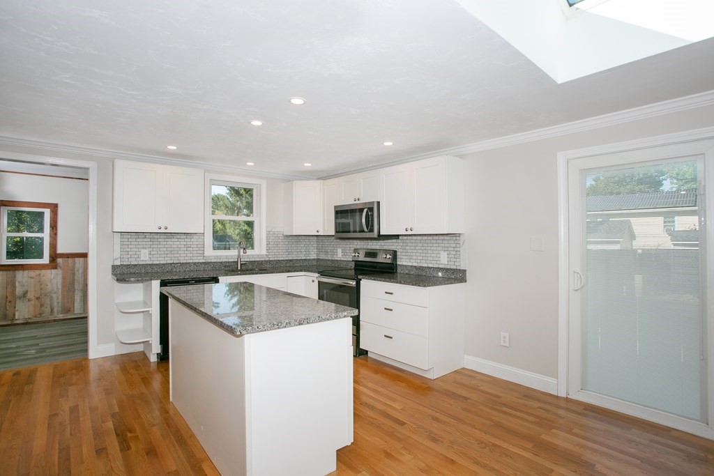 48 Madison Road Halifax, MA 02338 - Photo 8 of 12 a kitchen with stainless steel appliances granite countertop a sink stove and refrigerator