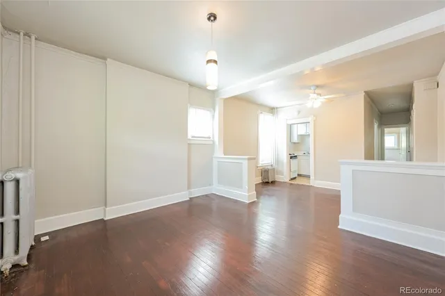 a view of a livingroom with wooden floor