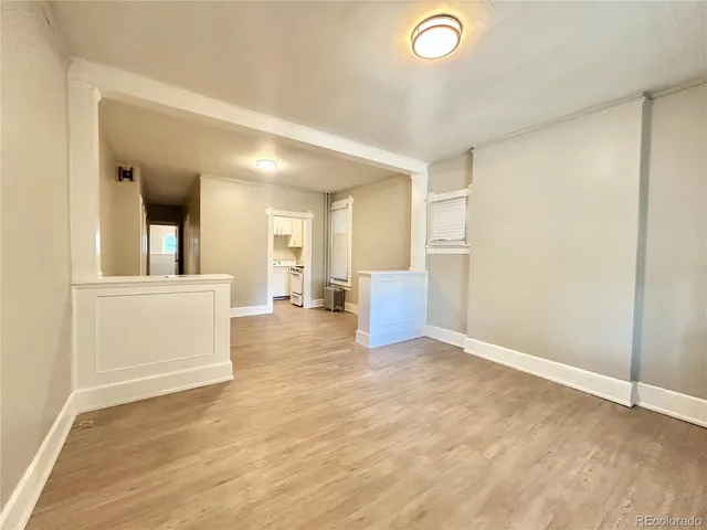 a view of a livingroom with a dishwasher and cabinets