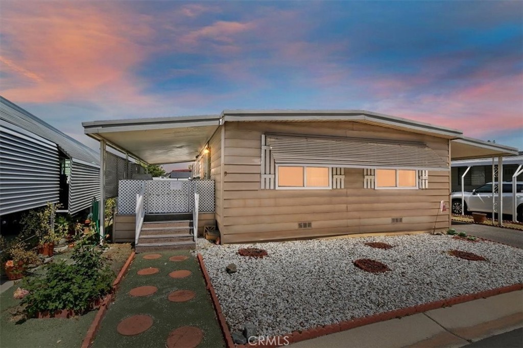 4000 Pierce Street, Unit 60 Riverside, CA 92505 - Photo 1 of 1 a front view of a house with garden