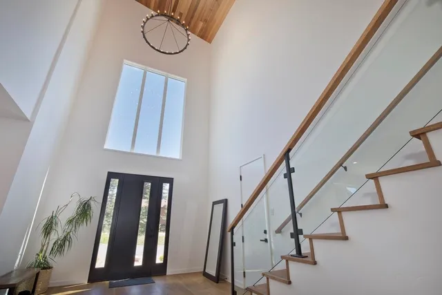 a view of an entryway with wooden floor