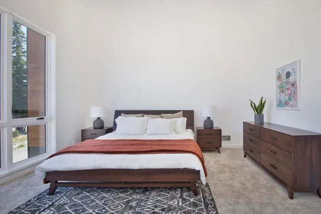 a bedroom with a bed and window