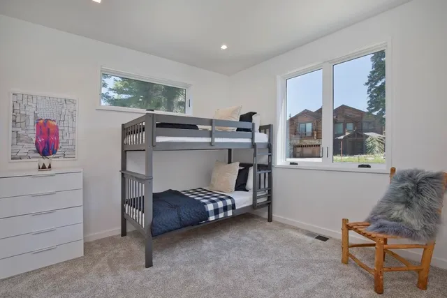 a bedroom with furniture and a window