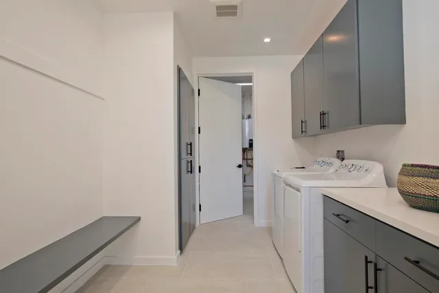 a view of a storage & utility room with a sink