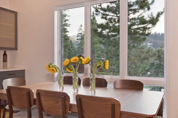 a kitchen with a refrigerator sink and wooden cabinets