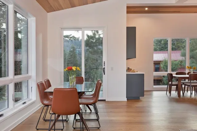 a dining room with furniture window wooden floor