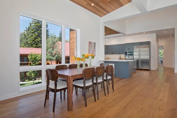 a kitchen with furniture and wooden floor