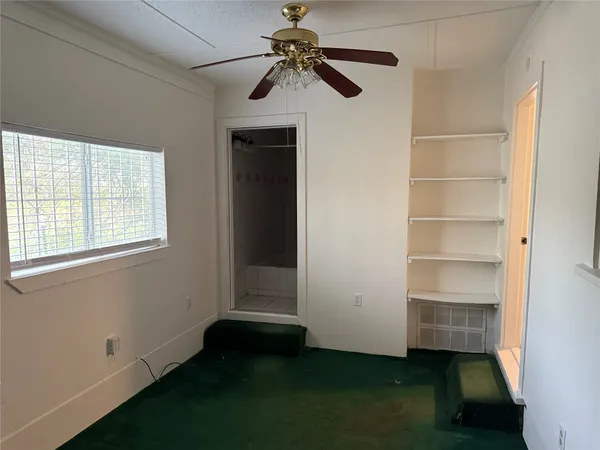 a room with a walk in closet and a window