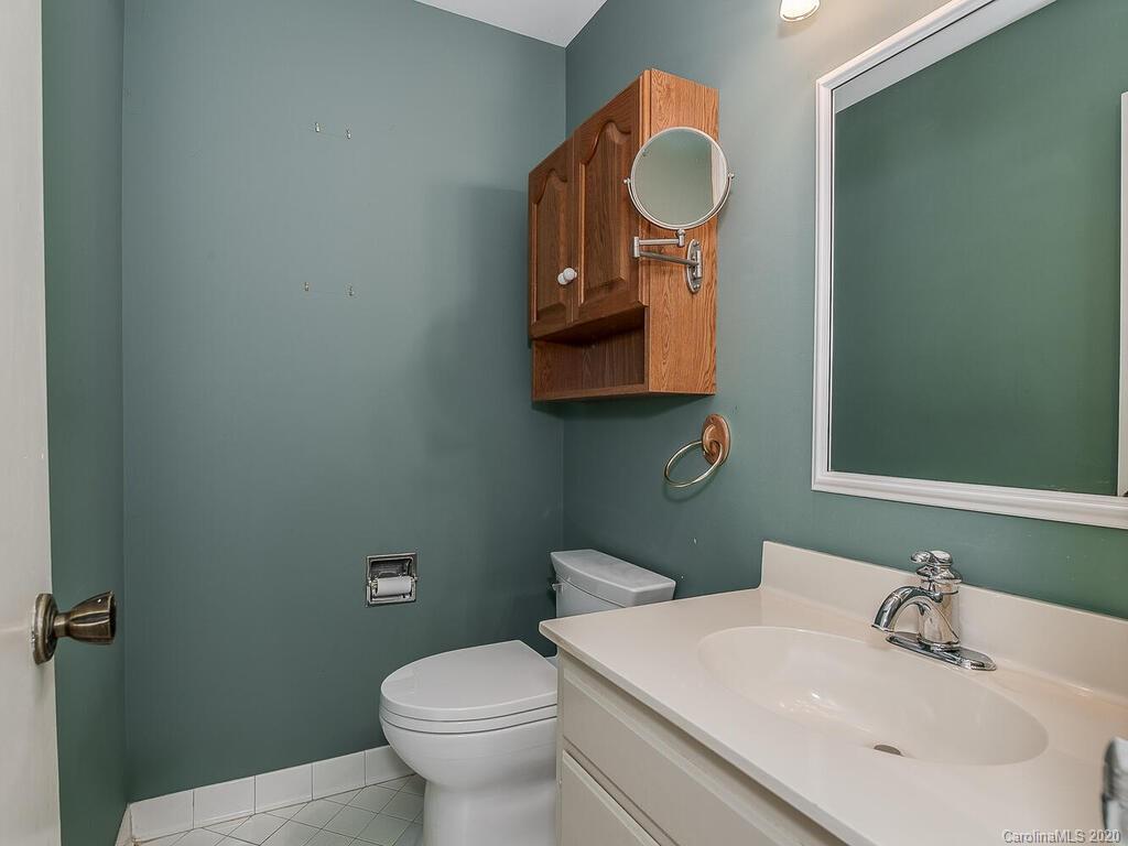 5012 Rounding Run Road Charlotte, NC 28277 - Photo 13 of 28 a bathroom with a toilet sink and mirror