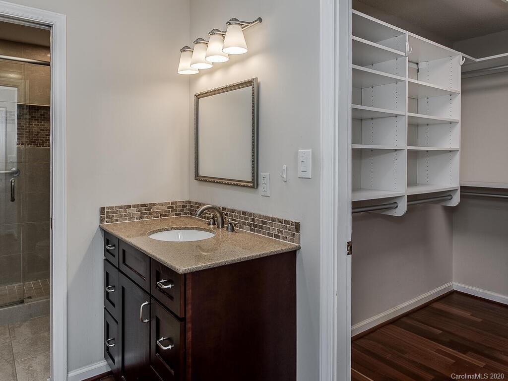 5012 Rounding Run Road Charlotte, NC 28277 - Photo 18 of 28 a bathroom with a sink and a mirror