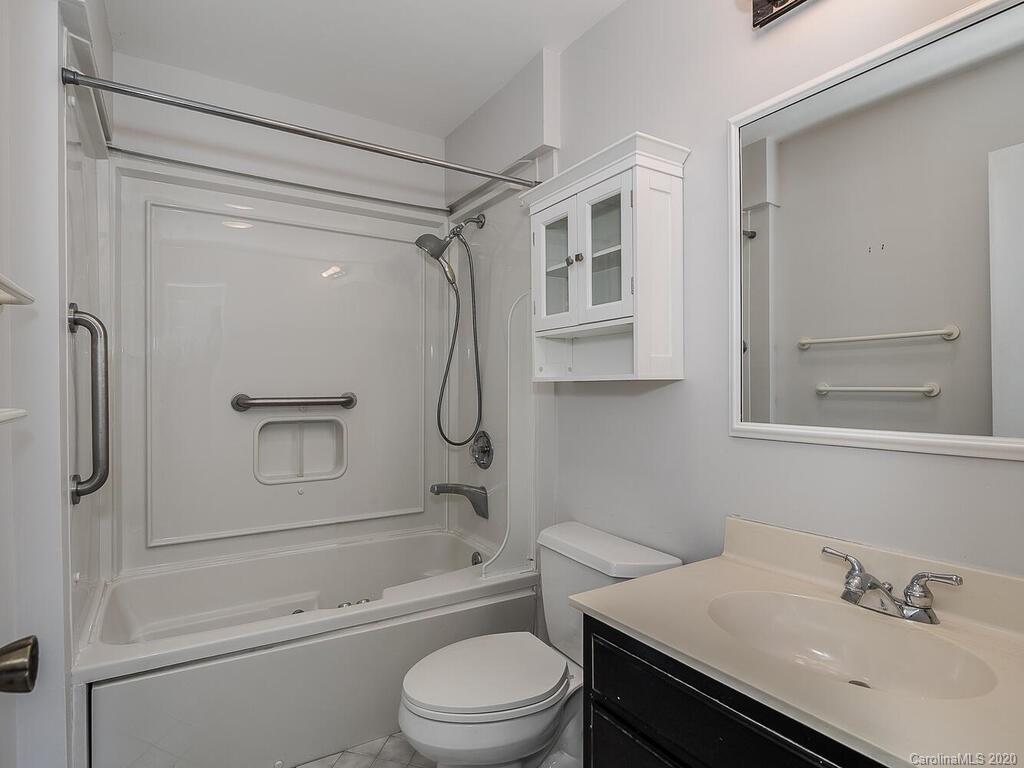 5012 Rounding Run Road Charlotte, NC 28277 - Photo 22 of 28 a bathroom with a sink toilet and shower