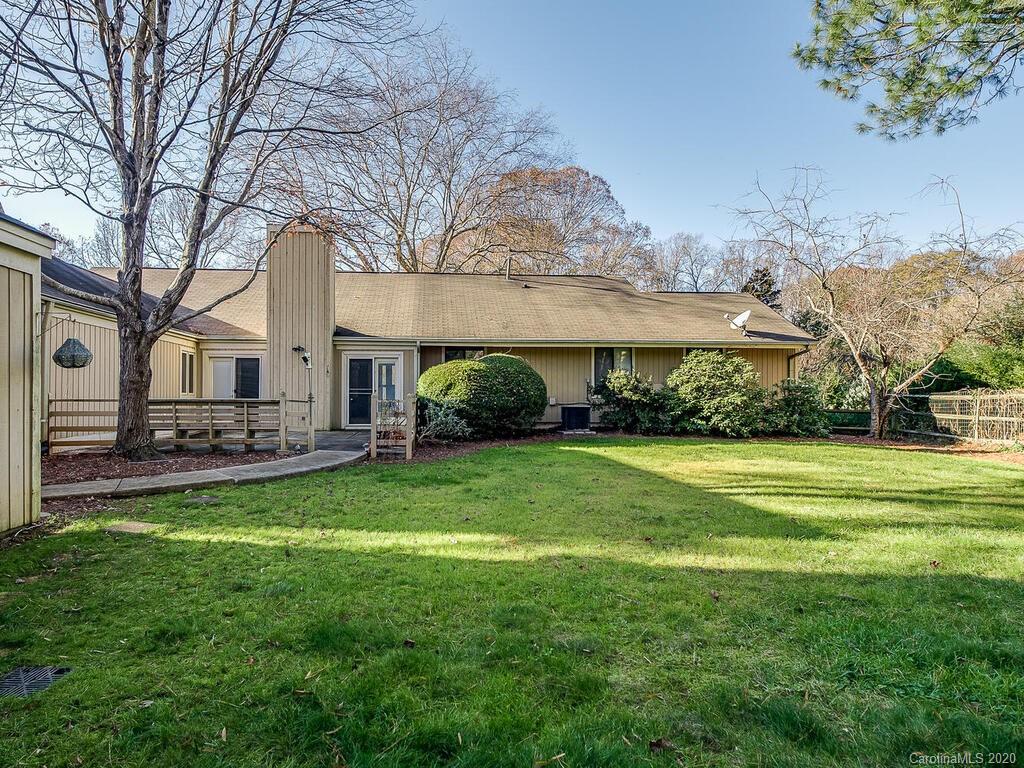 5012 Rounding Run Road Charlotte, NC 28277 - Photo 27 of 28 a view of a house with a big yard and large trees