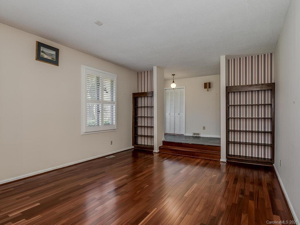 5012 Rounding Run Road Charlotte, NC 28277 - Photo 6 of 28 wooden floor in an empty room with a window