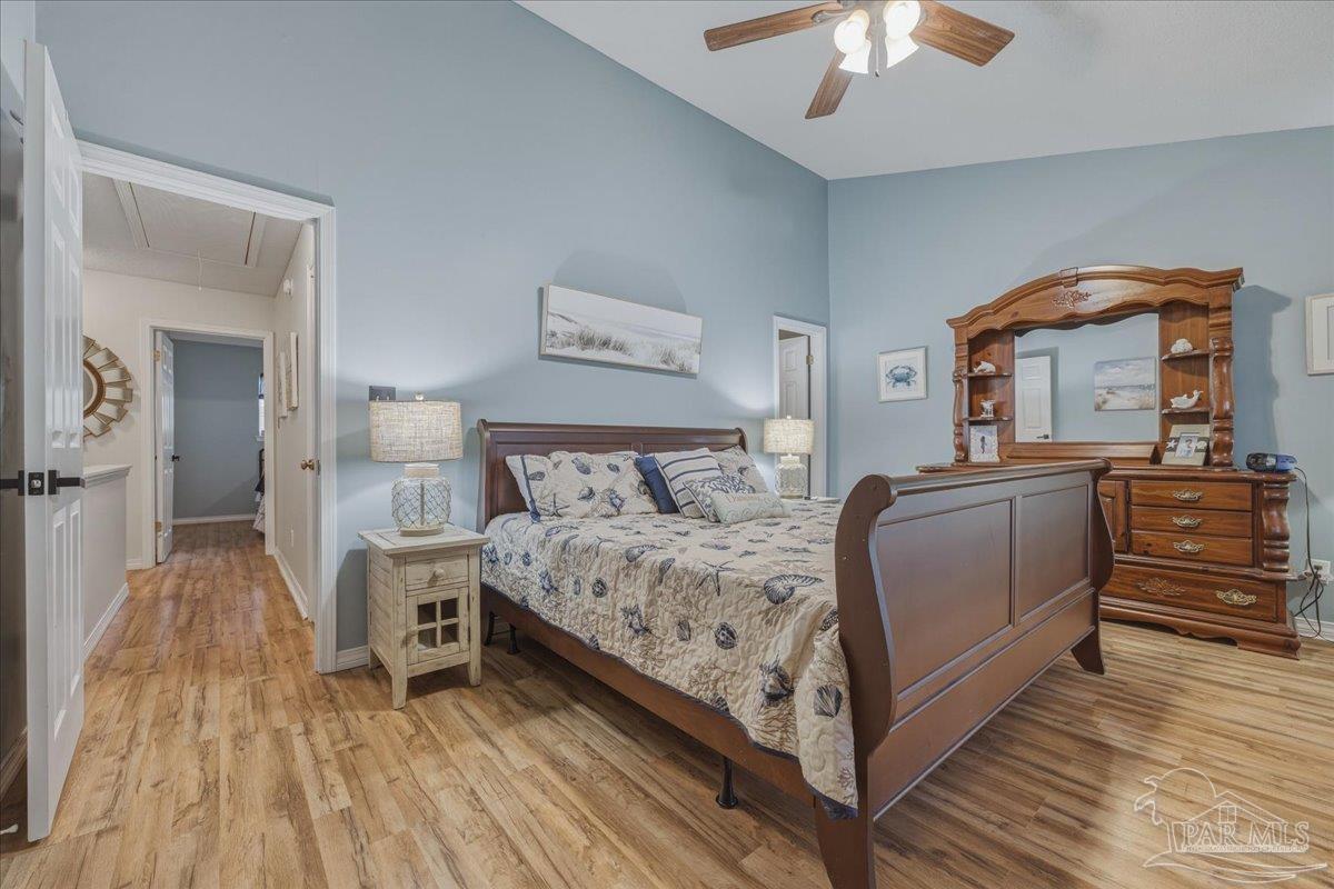 26063 Canal Road, Unit 3F Orange Beach, AL 36561 - Photo 44 of 72 a bed room with a bed and a chandelier