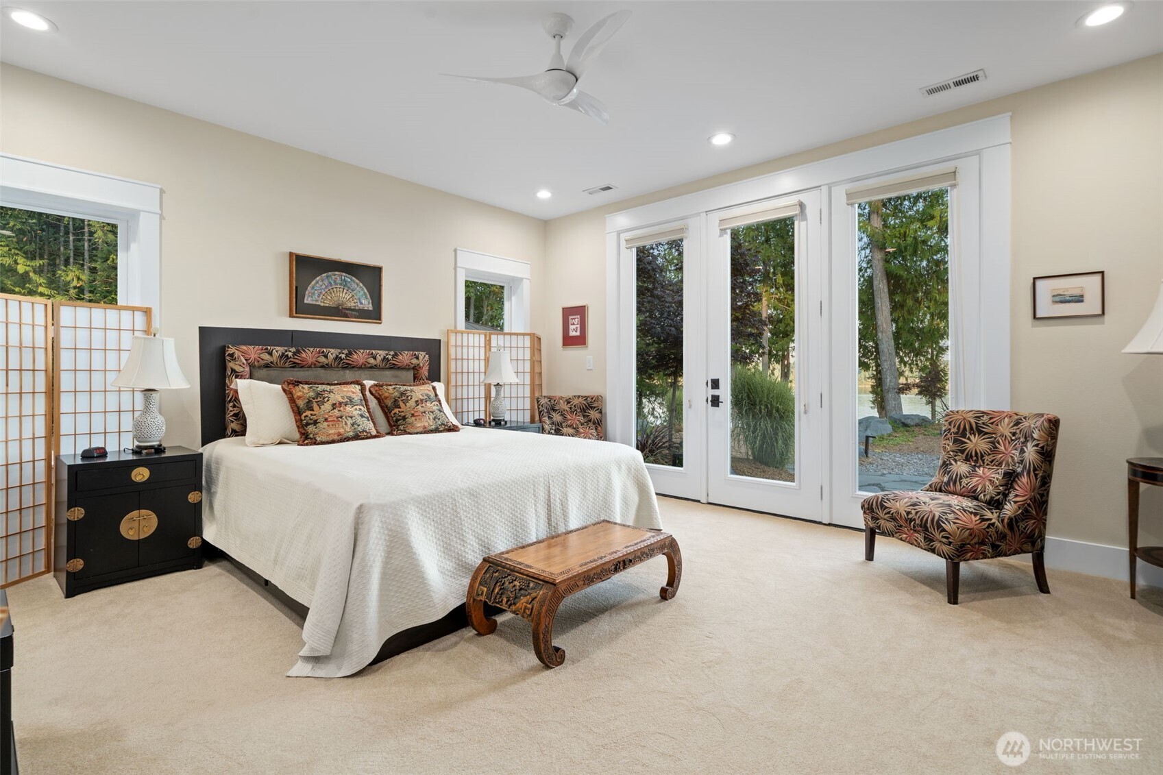 211 East Vineyard Crest Road Grapeview, WA 98546 - Photo 19 of 34 a bedroom with a bed and a couch