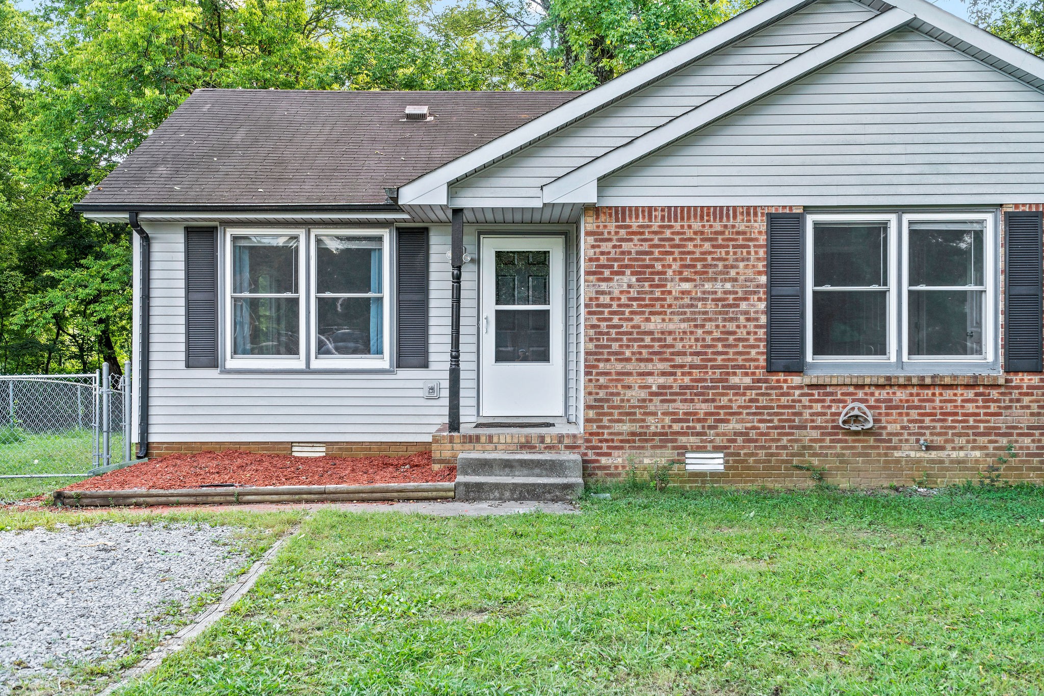 742 Needmore Road Clarksville, TN 37040 - Photo 1 of 35 a front view of a house with garden