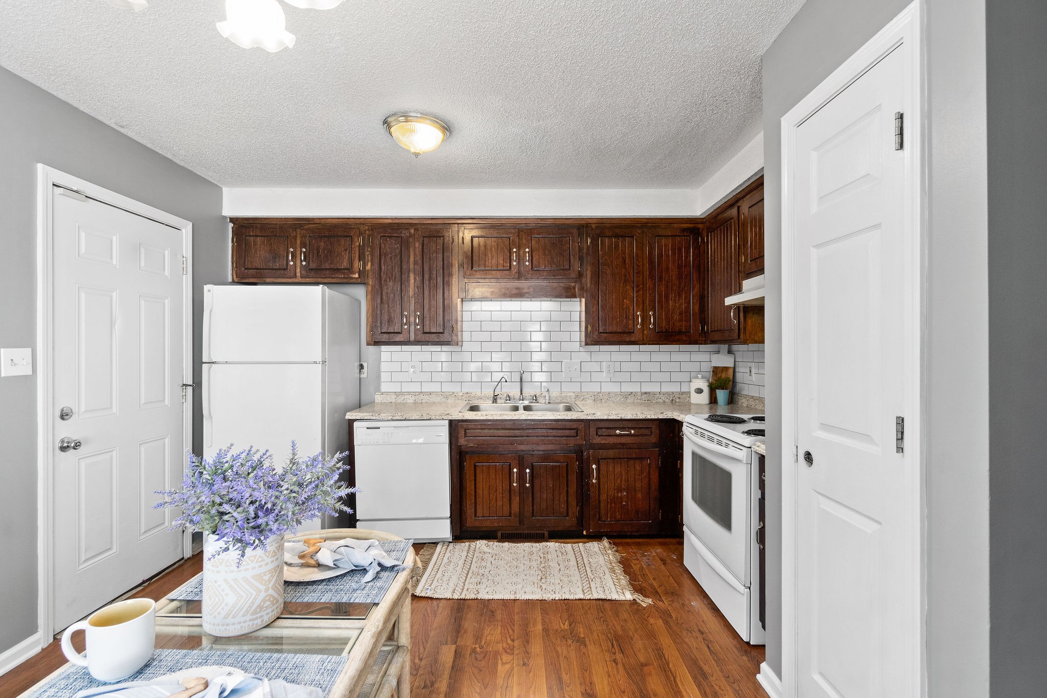 742 Needmore Road Clarksville, TN 37040 - Photo 12 of 35 a kitchen with stainless steel appliances granite countertop a sink stove and refrigerator