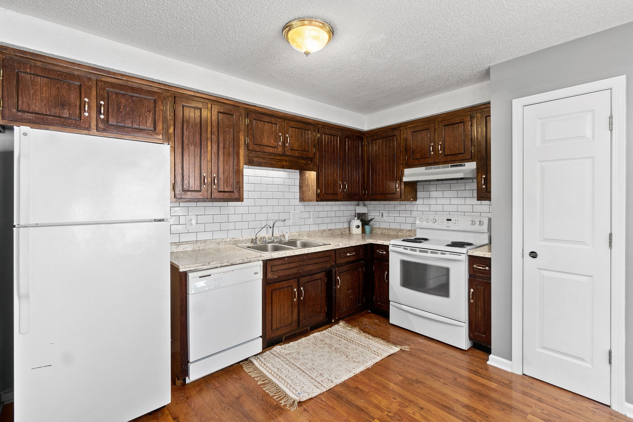 742 Needmore Road Clarksville, TN 37040 - Photo 14 of 35 a kitchen with stainless steel appliances granite countertop a stove a sink and a refrigerator