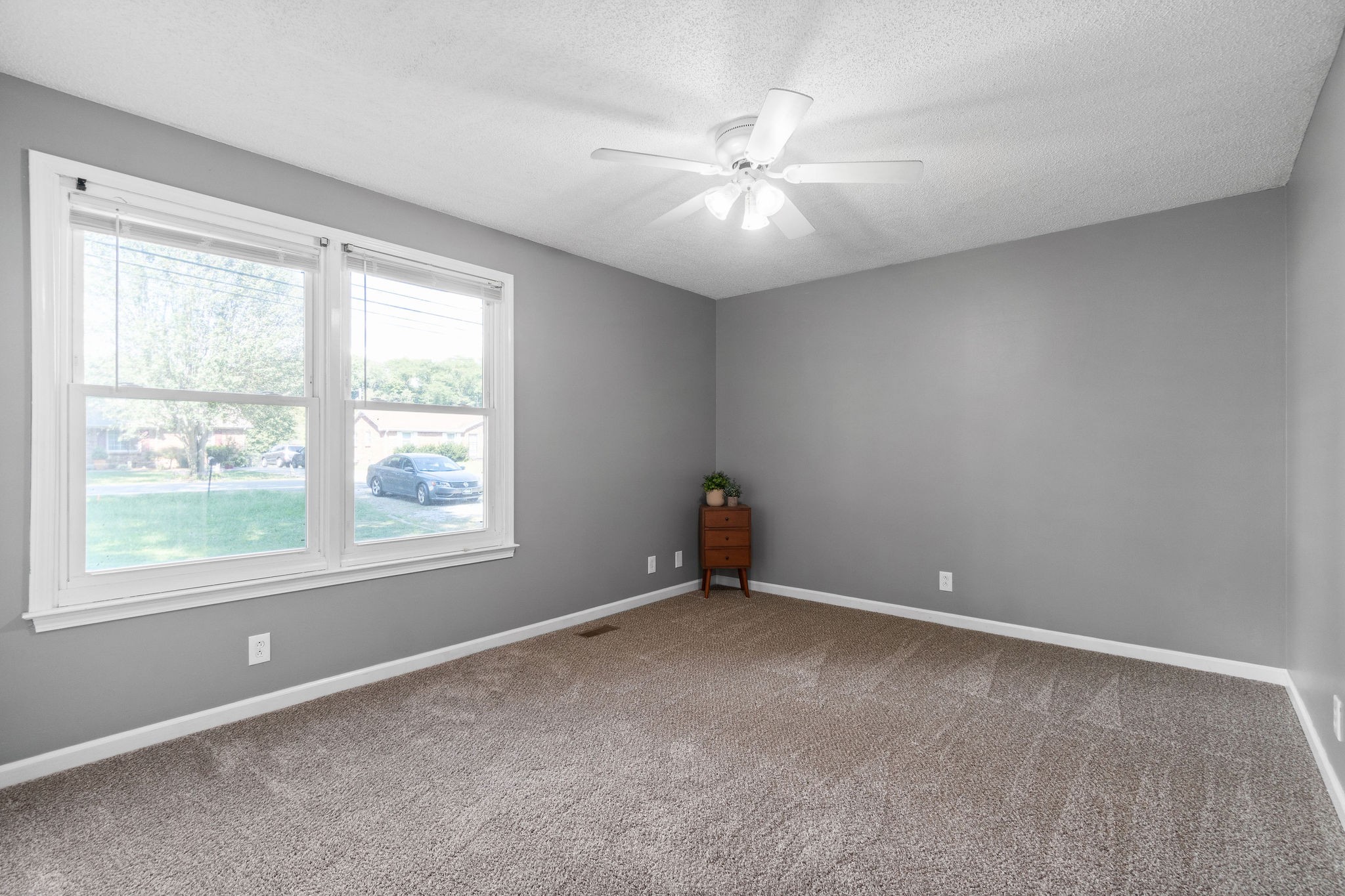 742 Needmore Road Clarksville, TN 37040 - Photo 17 of 35 an empty room with a window and a fan
