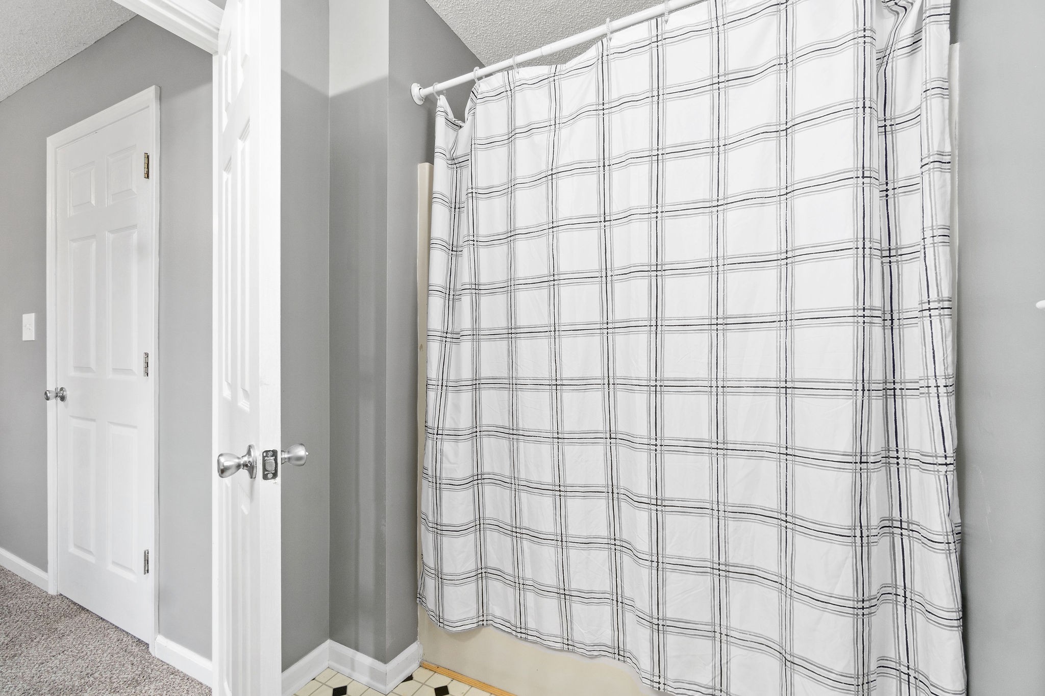 742 Needmore Road Clarksville, TN 37040 - Photo 21 of 35 a bathroom with a shower curtain