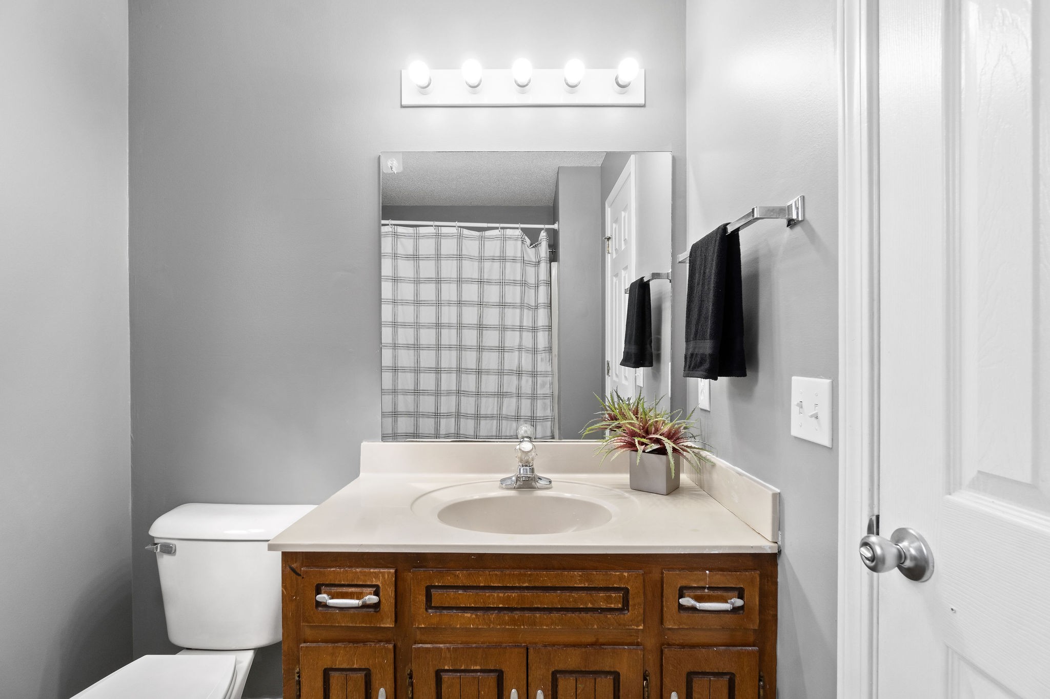 742 Needmore Road Clarksville, TN 37040 - Photo 22 of 35 a bathroom with a granite countertop sink a toilet a mirror and shower