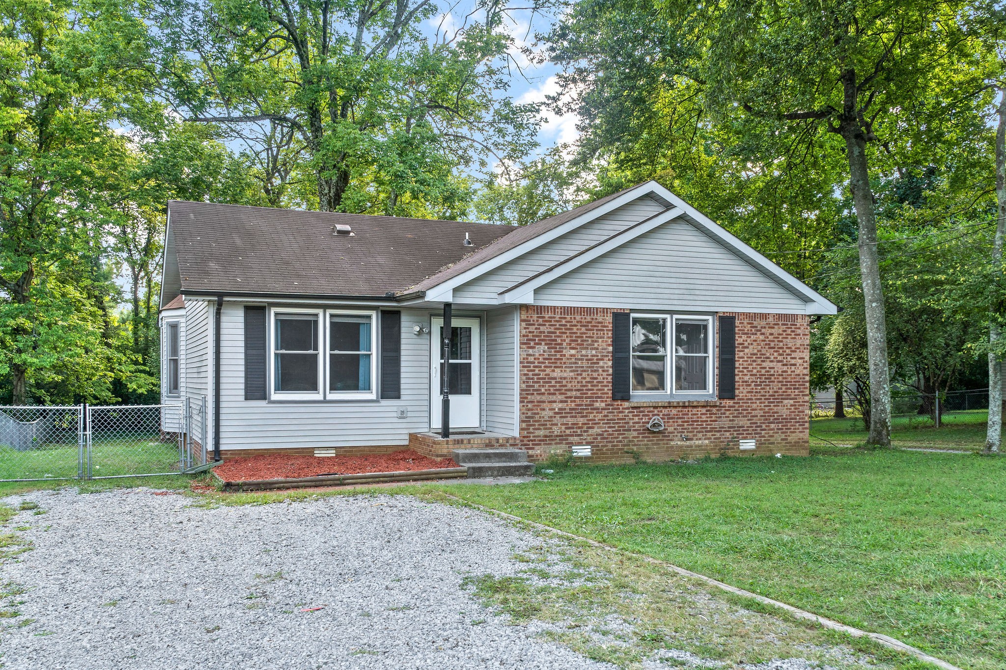 742 Needmore Road Clarksville, TN 37040 - Photo 35 of 35 a front view of a house with a yard and garage