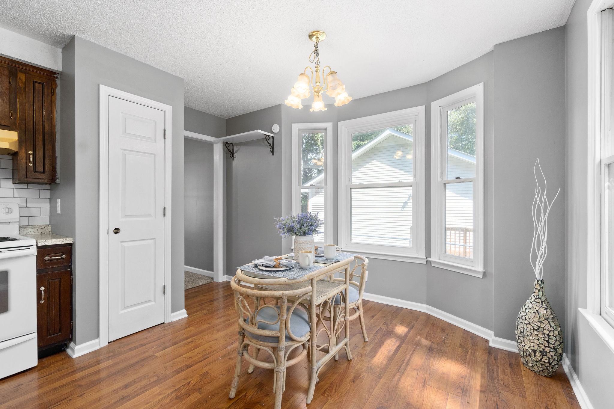 742 Needmore Road Clarksville, TN 37040 - Photo 10 of 35 a dining room with chandelier and wooden floor